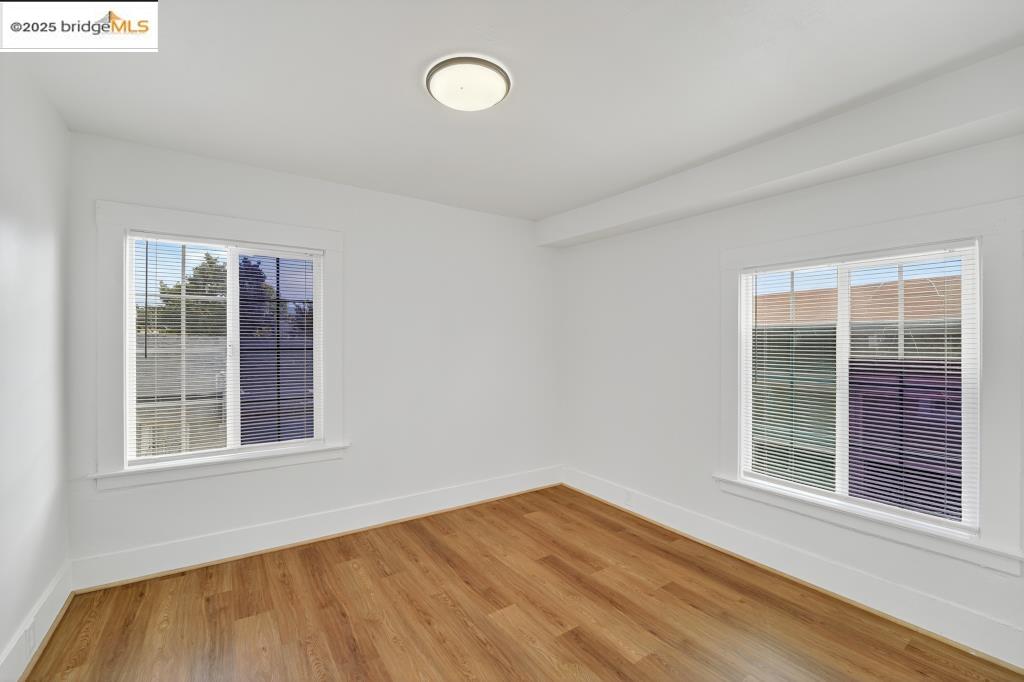 4114 East 17th Street Oakland, CA 94601 - Photo 13 of 39 a view of an empty room with wooden floor and a window