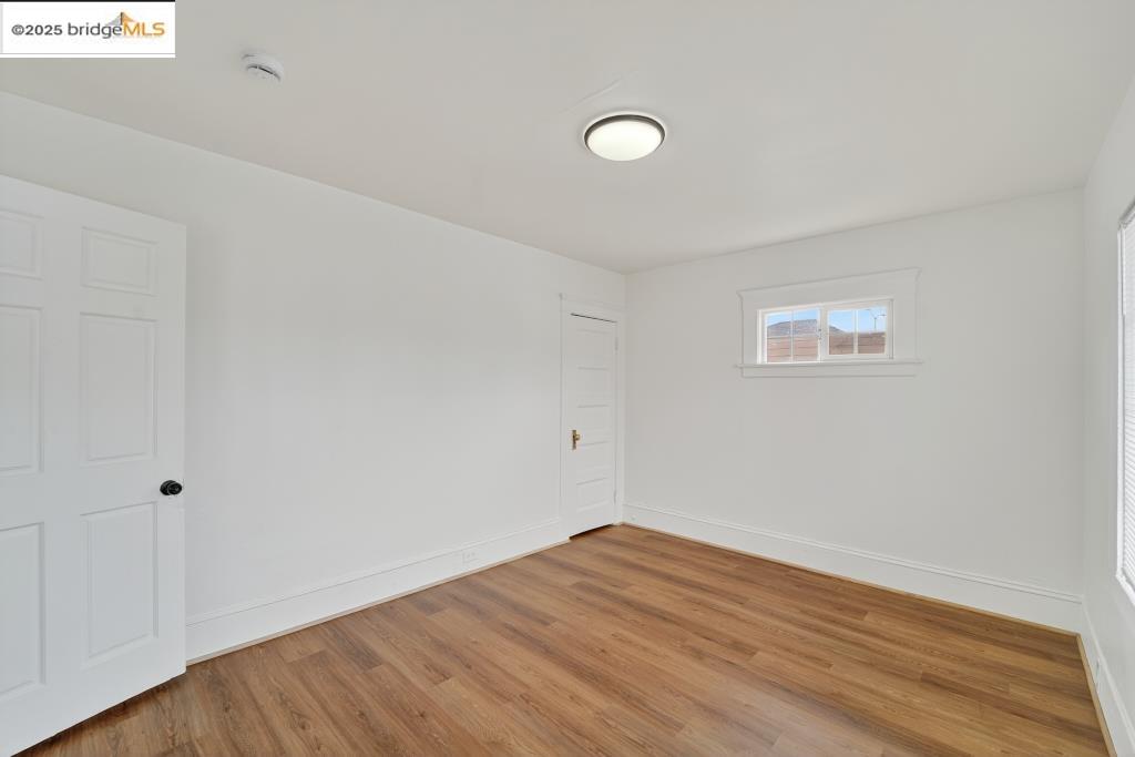 4114 East 17th Street Oakland, CA 94601 - Photo 16 of 39 a view of empty room with wooden floor