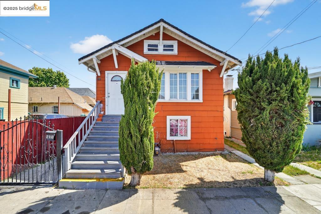 4114 East 17th Street Oakland, CA 94601 - Photo 3 of 39 a front view of a house with a yard