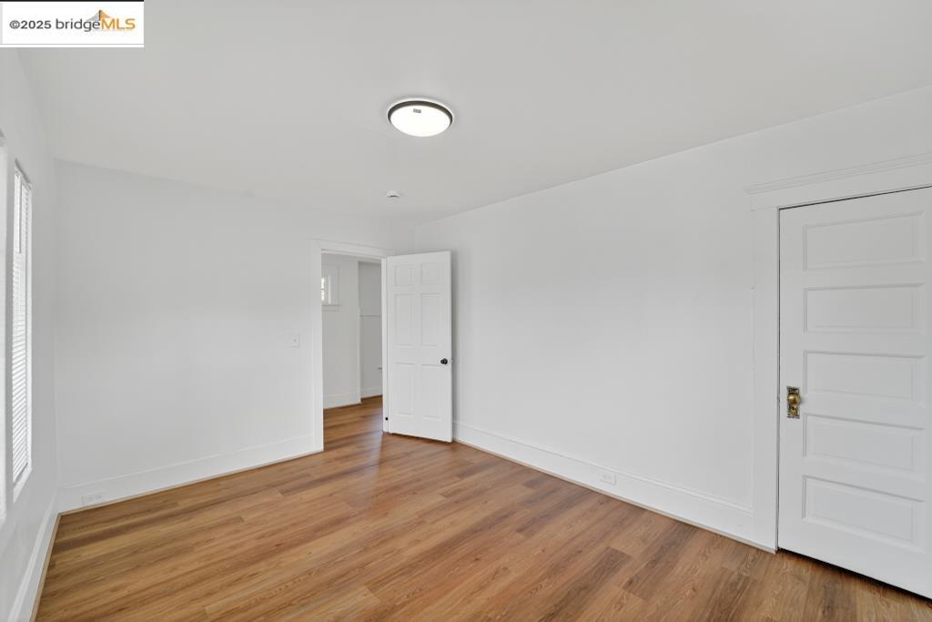 4114 East 17th Street Oakland, CA 94601 - Photo 35 of 39 a view of an empty room with wooden floor