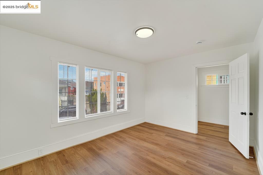 4114 East 17th Street Oakland, CA 94601 - Photo 36 of 39 a view of empty room with wooden floor and fan