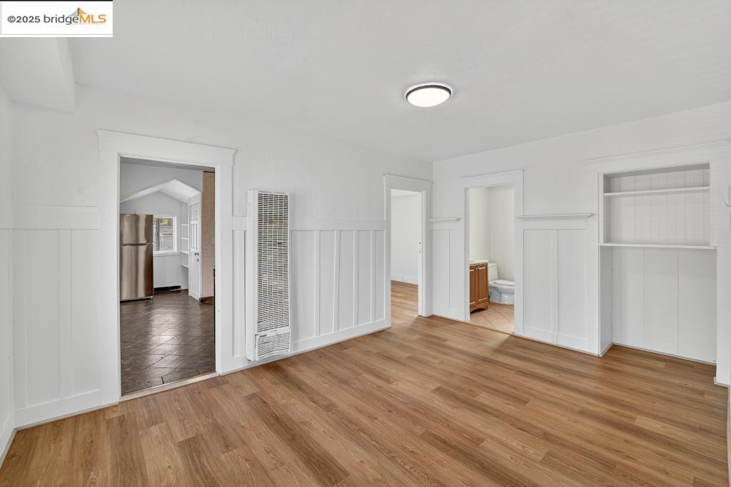 4114 East 17th Street Oakland, CA 94601 - Photo 6 of 39 a view of a livingroom with wooden floor and closet