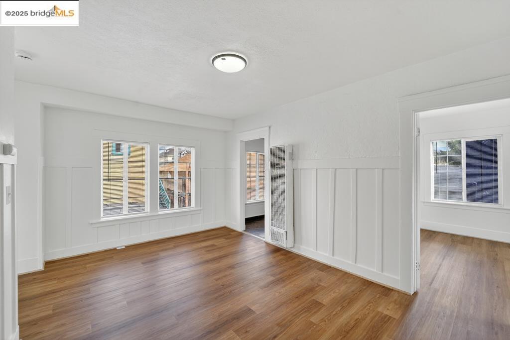 4114 East 17th Street Oakland, CA 94601 - Photo 7 of 39 a view of an empty room with wooden floor and a window