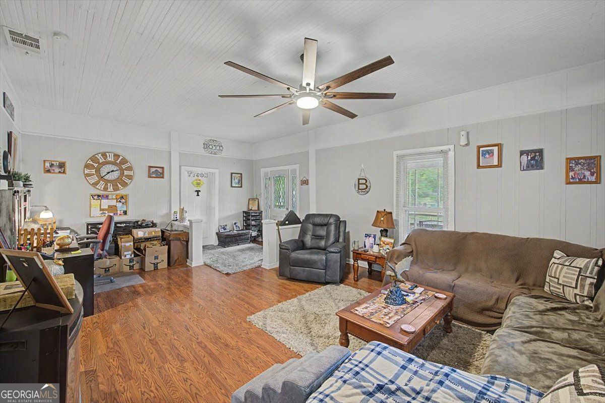 483 Coal Road Northwest Resaca, GA 30735 - Photo 13 of 56 a living room with furniture and wooden floor