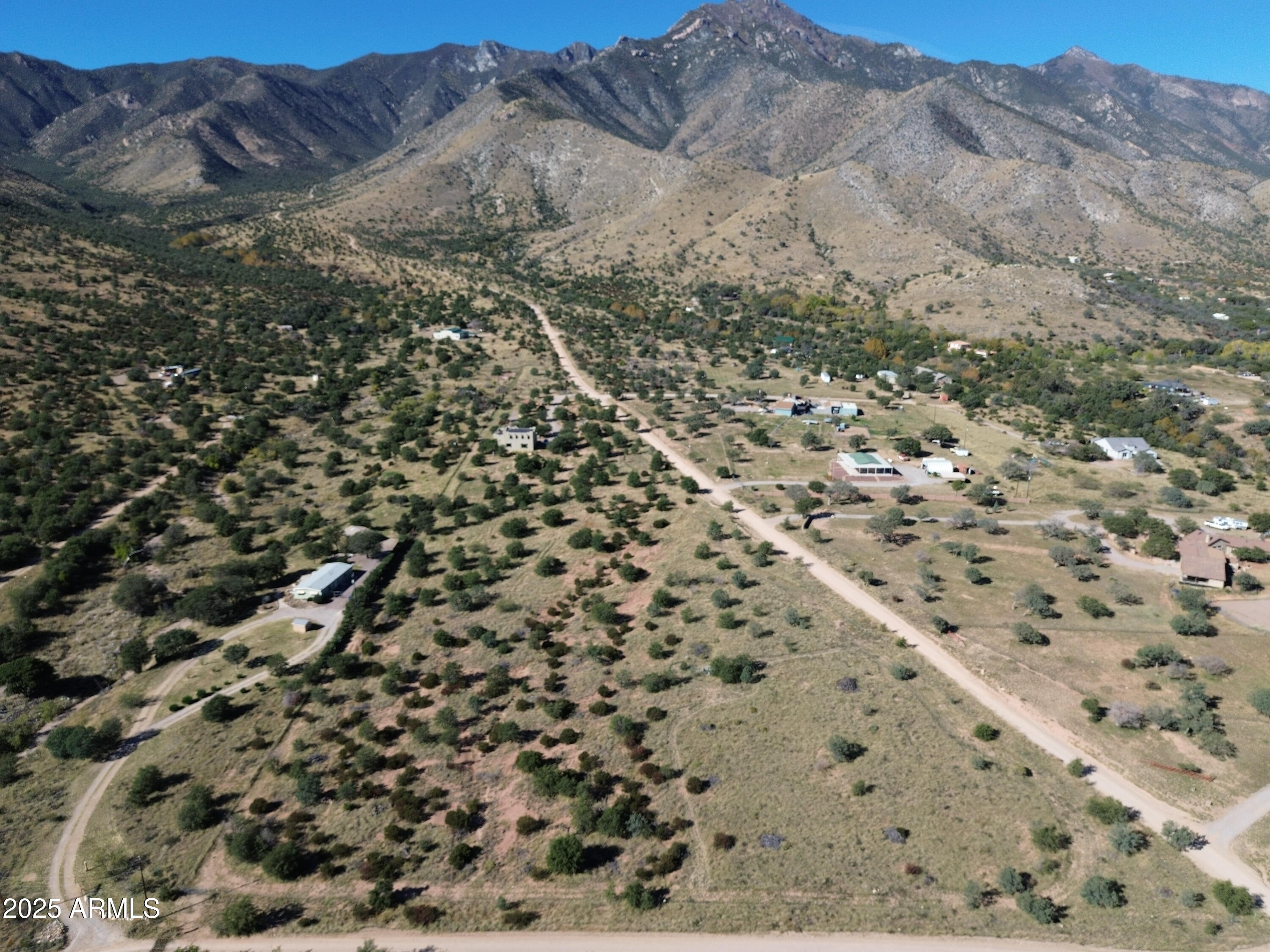 5358 East Ash Canyon Road Hereford, AZ 85615 - Photo 19 of 24 a view of a dry yard with mountains