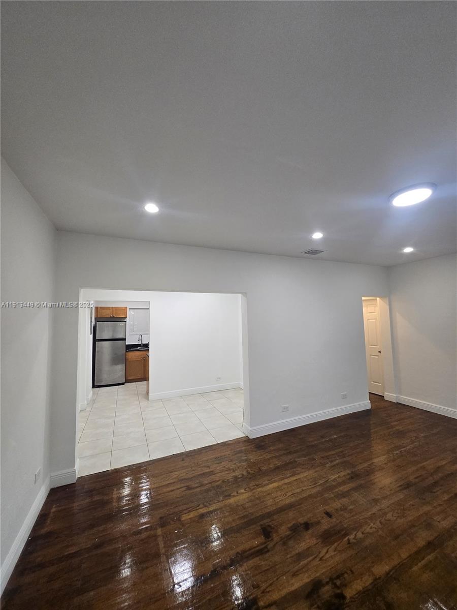 851 80th Street, Unit 4 Miami Beach, FL 33141 - Photo 1 of 9 a view of a livingroom with wooden floor