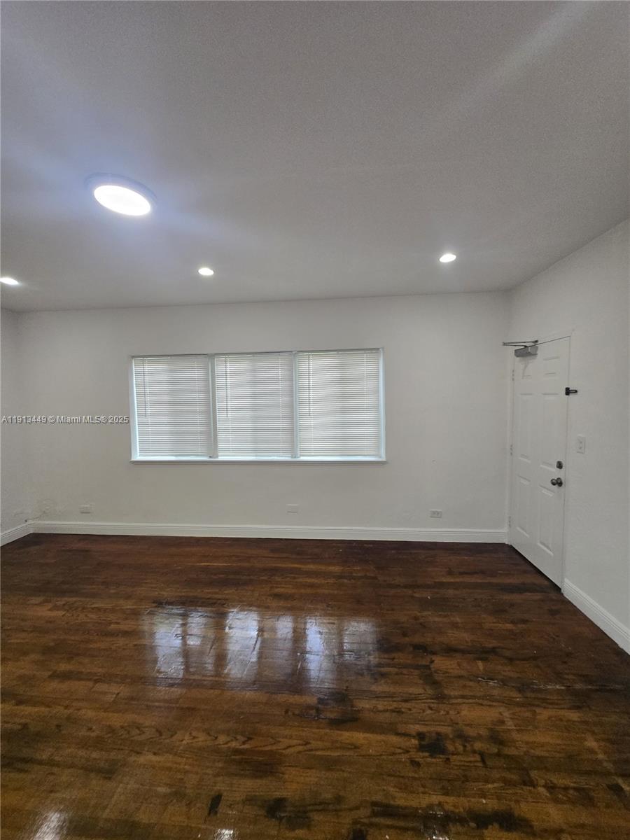 851 80th Street, Unit 4 Miami Beach, FL 33141 - Photo 6 of 9 a view of empty room with wooden floor