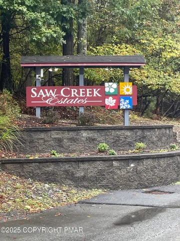 a view of outdoor space with deck and lake view
