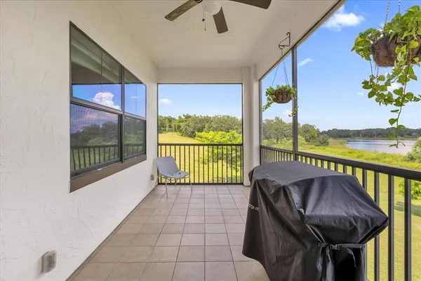a balcony with furniture and garden view
