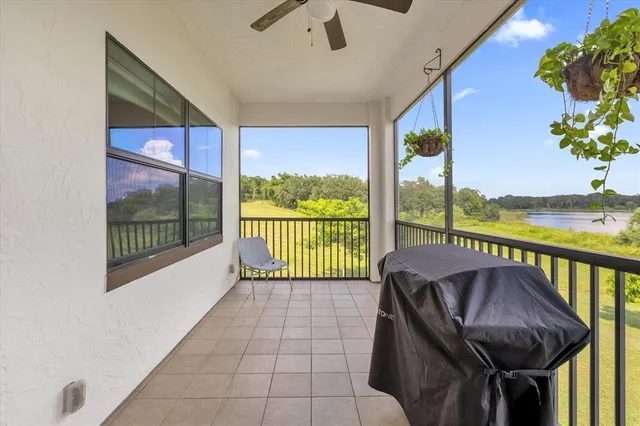 a balcony with furniture and garden view