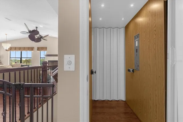a view of hallway with wooden floor