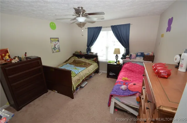 a bedroom with bed and a window