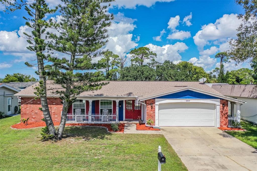 front view of a house with a yard