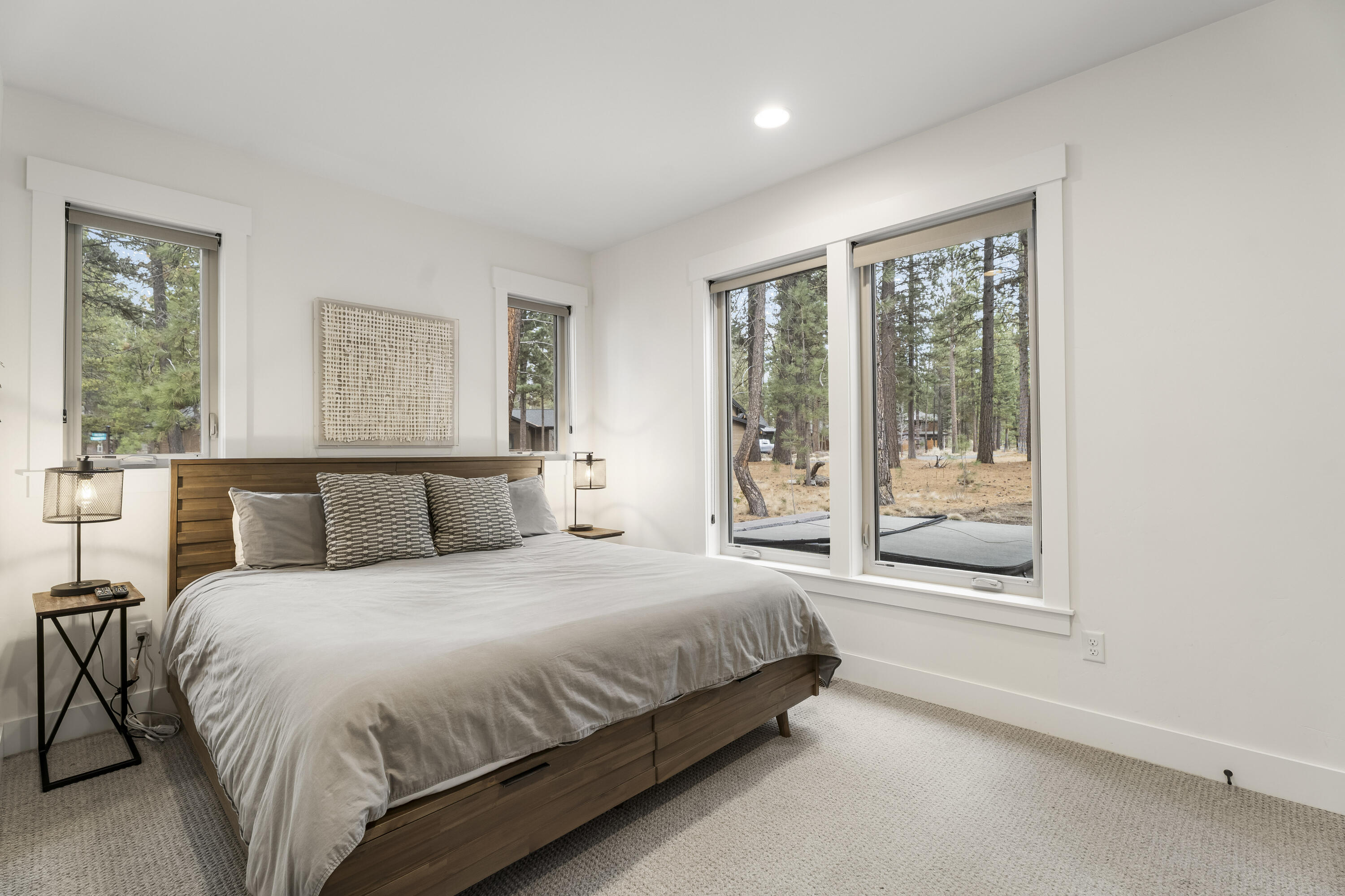 56302 Sable Rock Loop, Unit 255 Bend, OR 97707 - Photo 38 of 65 a bedroom with a large bed and a large window