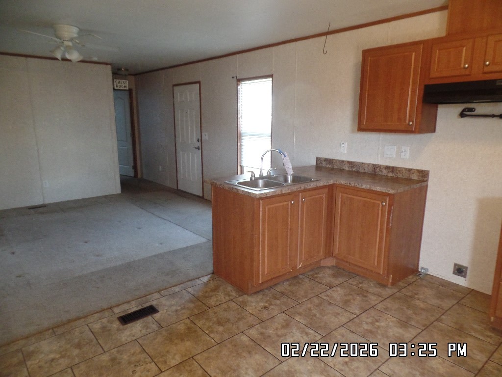 686 Ramar Road Bullhead City, AZ 86442 - Photo 9 of 22 a kitchen with stainless steel appliances granite countertop a sink stove and cabinets