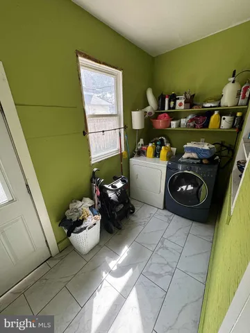 a kitchen with a refrigerator and a stove