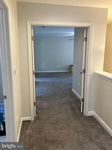 an empty room with a bench in it