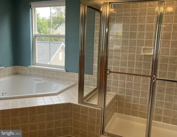 a bath tub sitting next to a window