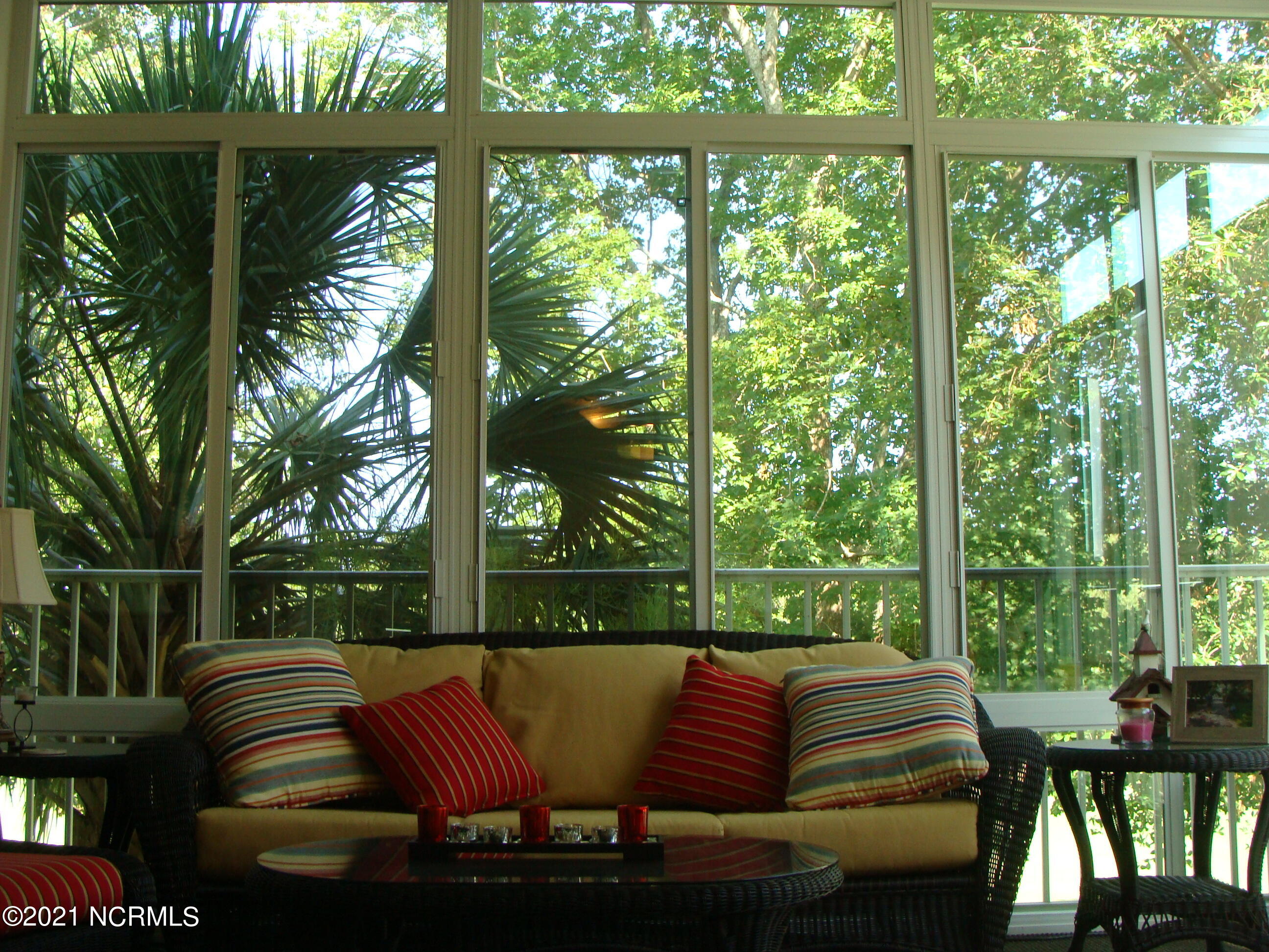 184 Clubhouse Road, Unit 4 Sunset Beach, NC 28468 - Photo 16 of 41 2 Walls of 10' high glass windows.