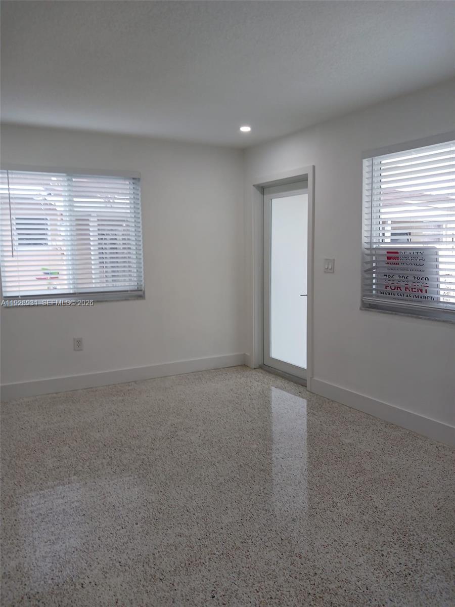 9228 Southwest 37th Street, Unit 9228 Miami, FL 33165 - Photo 11 of 25 a view of an empty room with a window