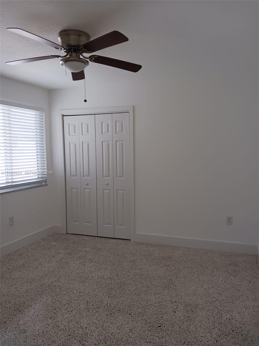 9228 Southwest 37th Street, Unit 9228 Miami, FL 33165 - Photo 14 of 25 a view of an empty room