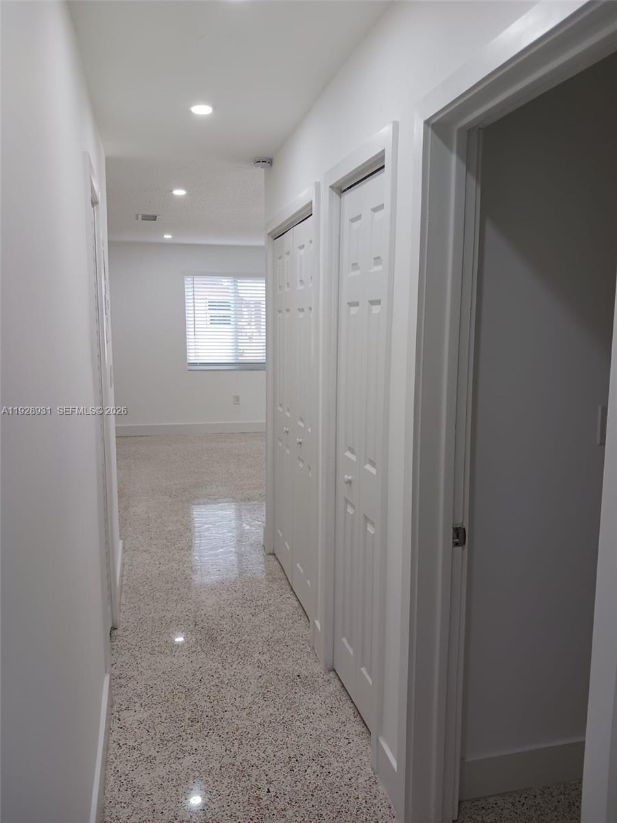 9228 Southwest 37th Street, Unit 9228 Miami, FL 33165 - Photo 17 of 25 a view of a hallway