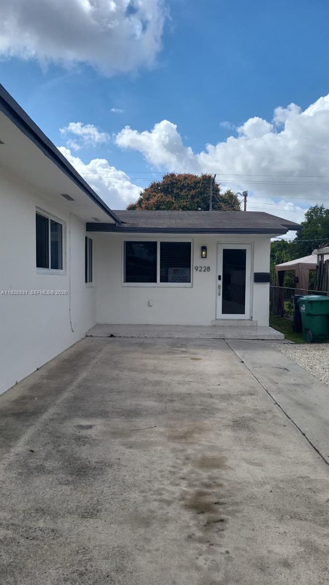9228 Southwest 37th Street, Unit 9228 Miami, FL 33165 - Photo 2 of 25 a view of a house with a backyard