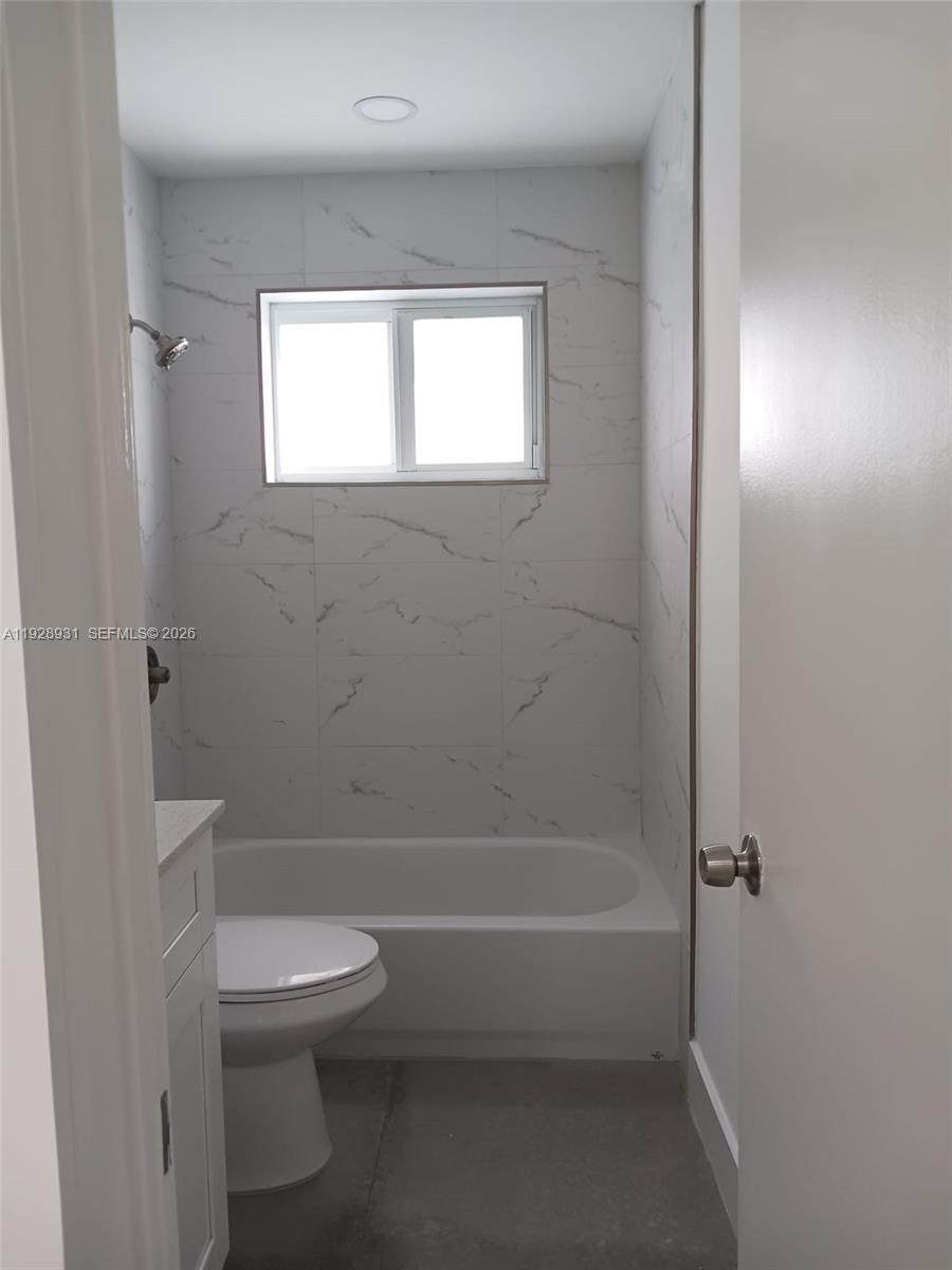 9228 Southwest 37th Street, Unit 9228 Miami, FL 33165 - Photo 24 of 25 a bathroom with a toilet and a shower