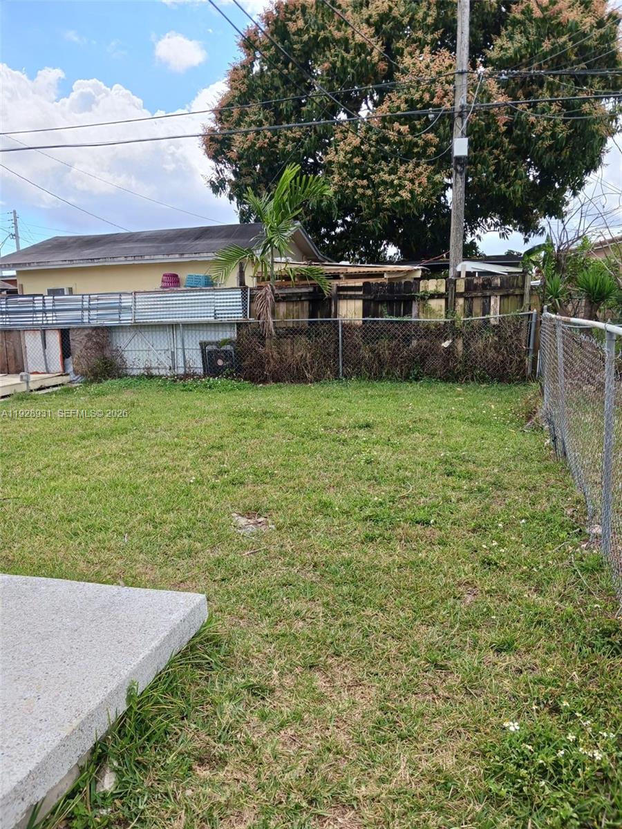 9228 Southwest 37th Street, Unit 9228 Miami, FL 33165 - Photo 25 of 25 a view of a backyard with a garden and entertaining space