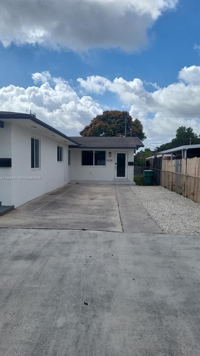 9228 Southwest 37th Street, Unit 9228 Miami, FL 33165 - Photo 3 of 25 a view of a house with roof