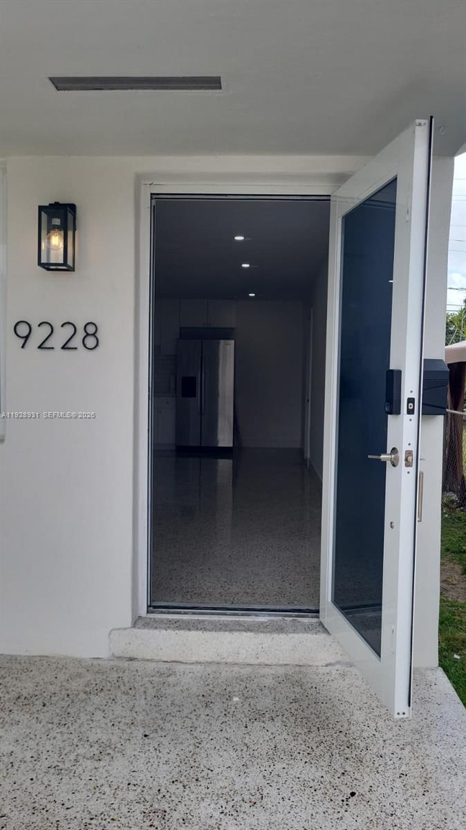 9228 Southwest 37th Street, Unit 9228 Miami, FL 33165 - Photo 4 of 25 a view of a hallway with a room