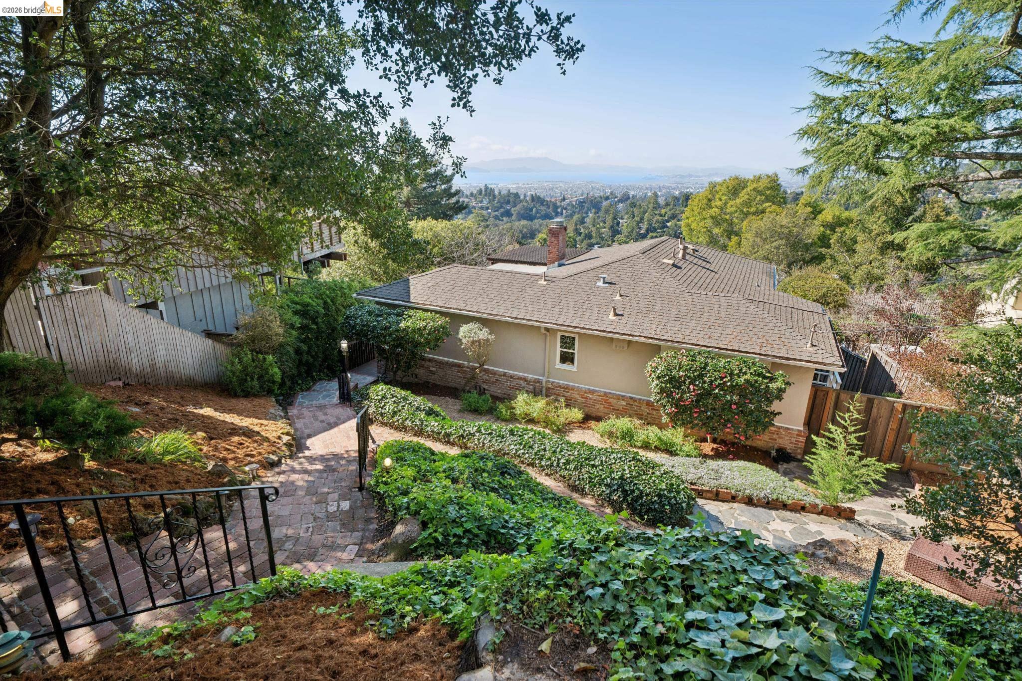 6411 Snake Road Oakland, CA 94611 - Photo 1 of 1 Exterior space with stucco siding and a chimney