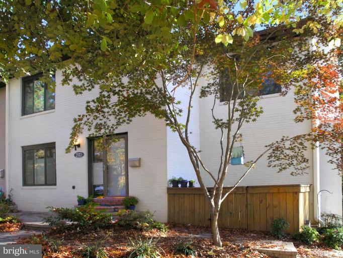 2023 Sarazen Place Reston, VA 20191 - Photo 1 of 30 a front view of a house with trees