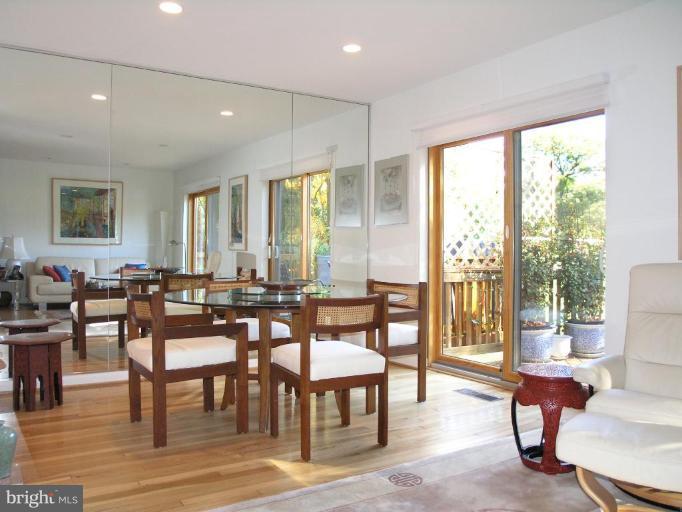 2023 Sarazen Place Reston, VA 20191 - Photo 16 of 30 a view of a a dining room with furniture window and wooden floor