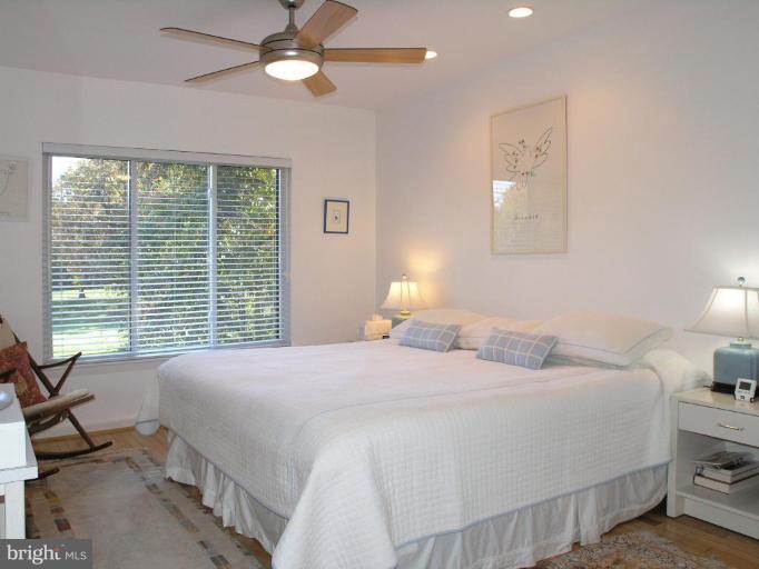 2023 Sarazen Place Reston, VA 20191 - Photo 23 of 30 a bedroom with a bed and a window