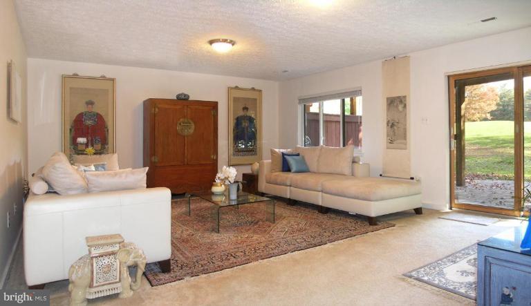 2023 Sarazen Place Reston, VA 20191 - Photo 26 of 30 a living room with furniture and a large window