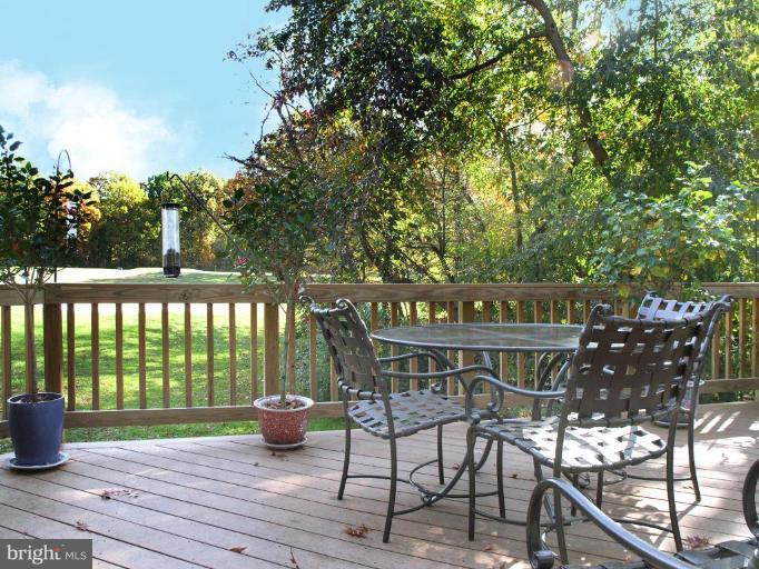 2023 Sarazen Place Reston, VA 20191 - Photo 4 of 30 a view of a chairs and table on the deck