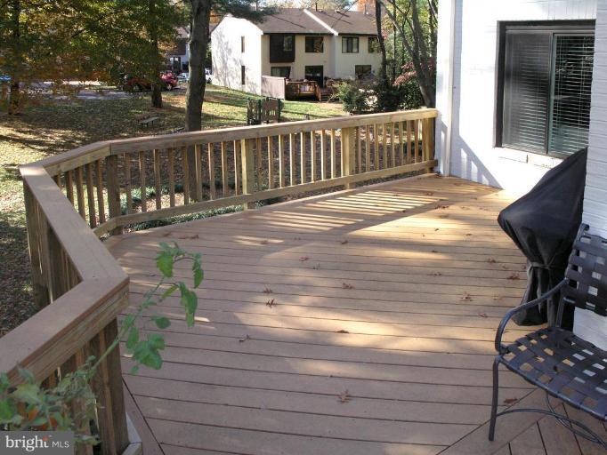 2023 Sarazen Place Reston, VA 20191 - Photo 5 of 30 a view of a deck with two chair and table