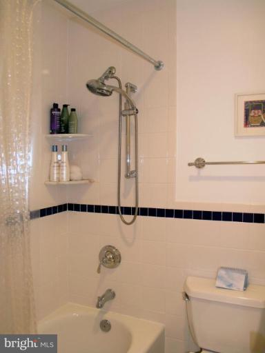 2023 Sarazen Place Reston, VA 20191 - Photo 7 of 30 a bathroom with a shower and a toilet