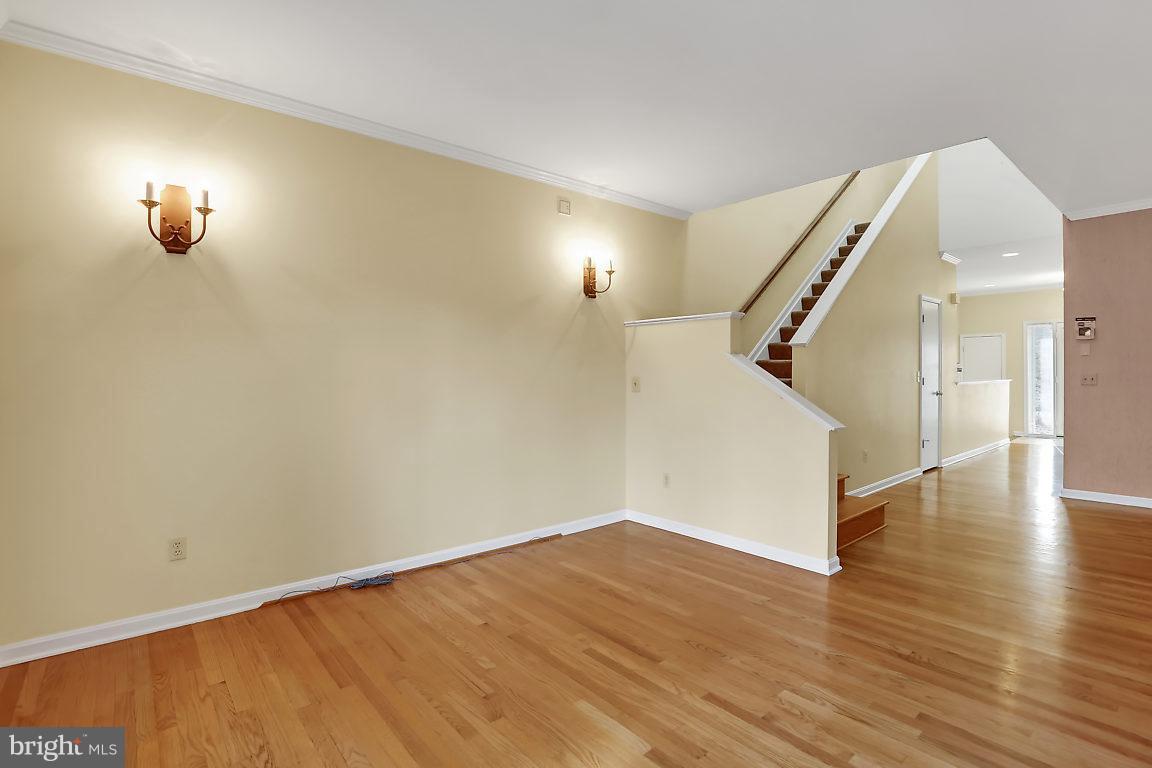 5711 Visitation Way Baltimore, MD 21210 - Photo 11 of 25 a view of empty room with wooden floor
