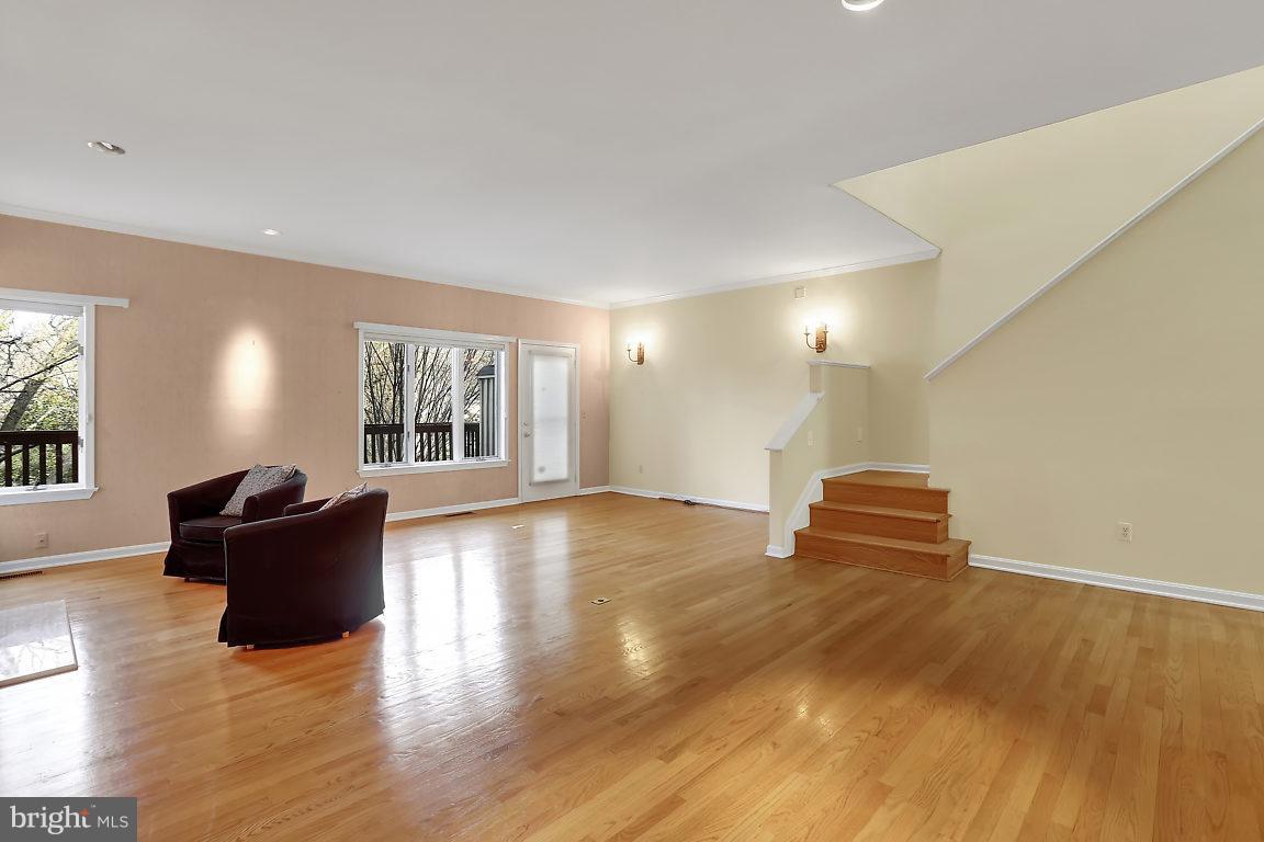 5711 Visitation Way Baltimore, MD 21210 - Photo 8 of 25 a view of empty room with wooden floor and fan