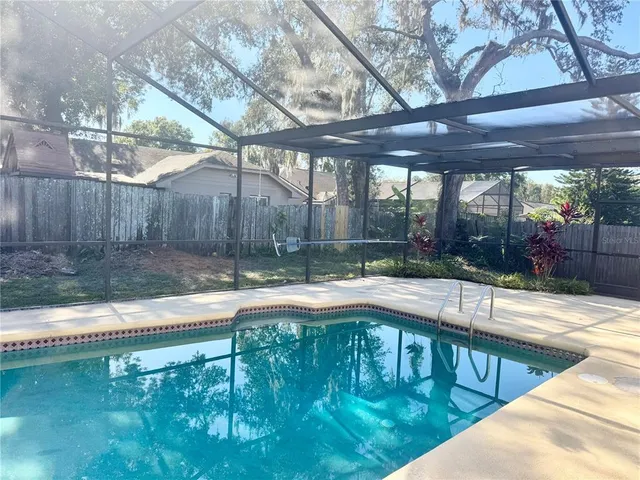 a view of a swimming pool with a patio