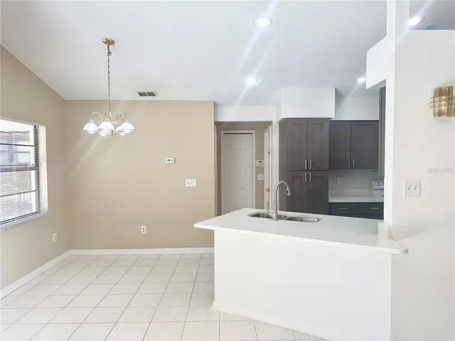 a bathroom with a sink a shower and a mirror