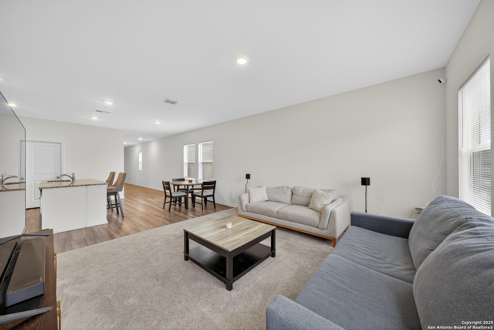 7710 Fern Hollow San Antonio, TX 78252 - Photo 11 of 26 a living room with furniture and a table