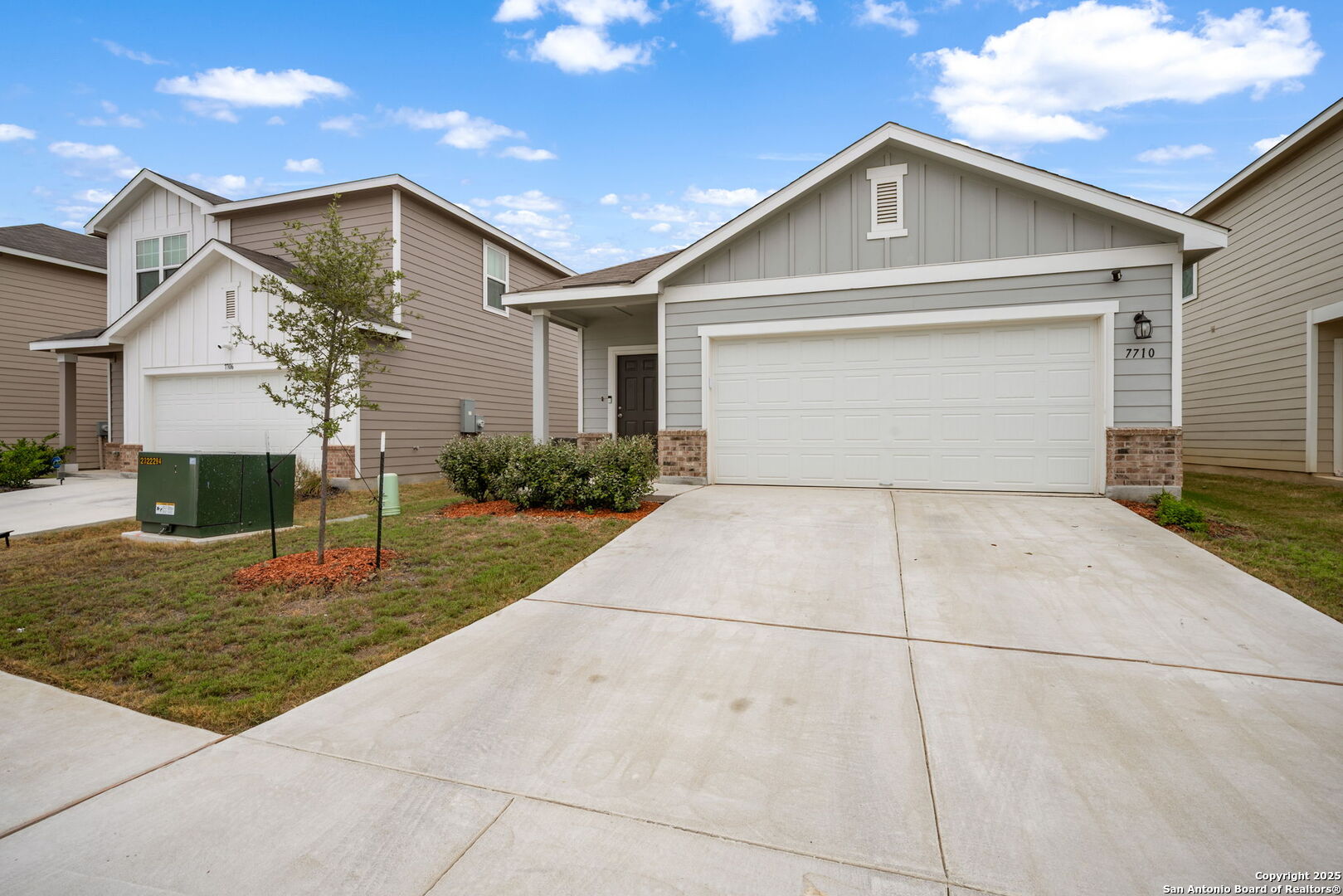 7710 Fern Hollow San Antonio, TX 78252 - Photo 2 of 26 a front view of a house with garden