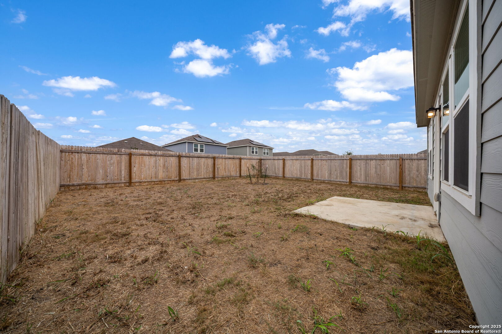 7710 Fern Hollow San Antonio, TX 78252 - Photo 21 of 26 a view of a backyard with a large tree