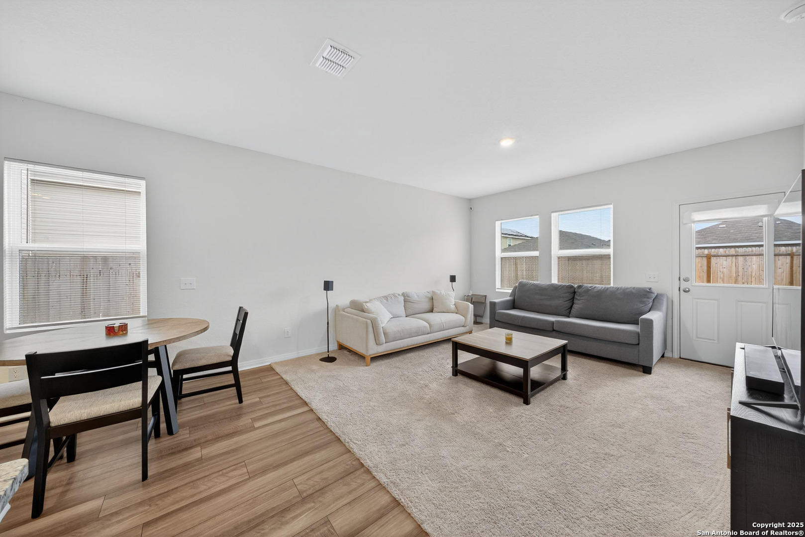 7710 Fern Hollow San Antonio, TX 78252 - Photo 10 of 26 a living room with furniture and a wooden floor