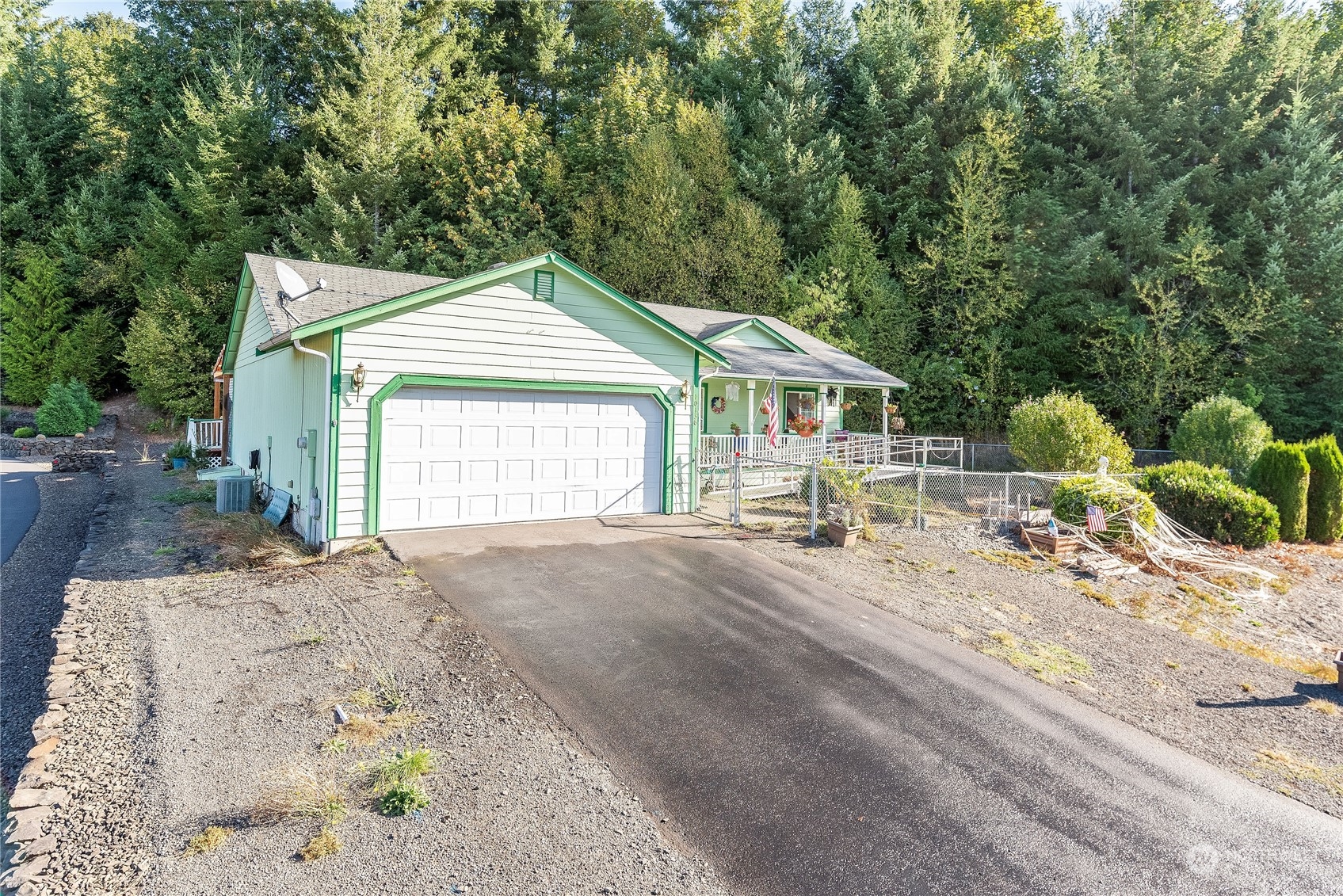 10136 Meadowside Lane Southwest Rochester, WA 98579 - Photo 31 of 32 a front view of a house with a yard
