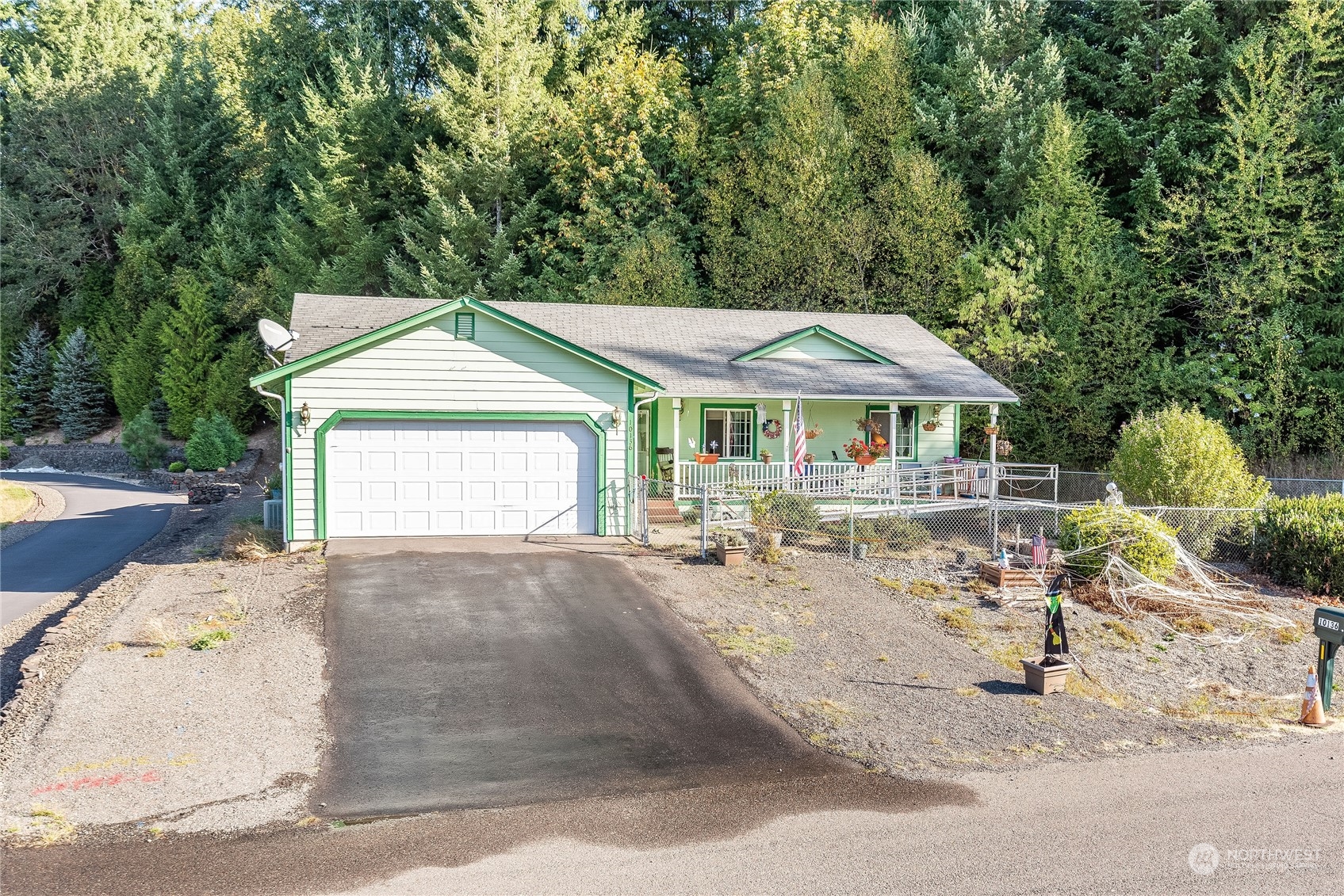 10136 Meadowside Lane Southwest Rochester, WA 98579 - Photo 32 of 32 a front view of a house with garden
