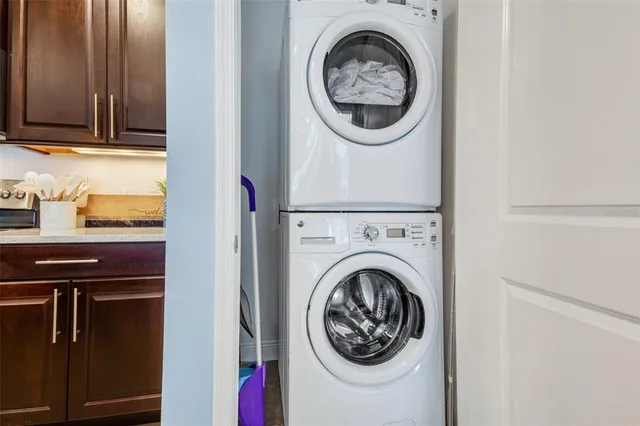 a living room with lots of furniture and a large window